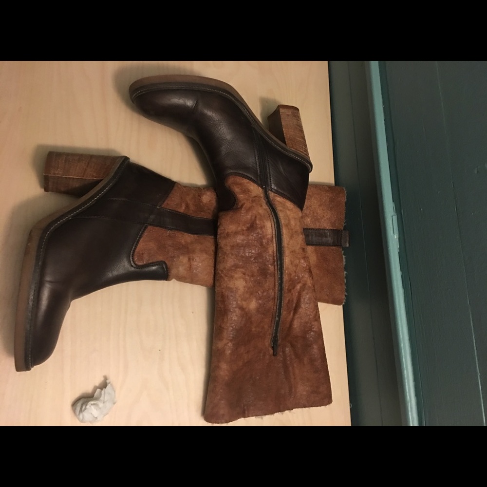 Leather, stack heel, lined to-the-knee boot.